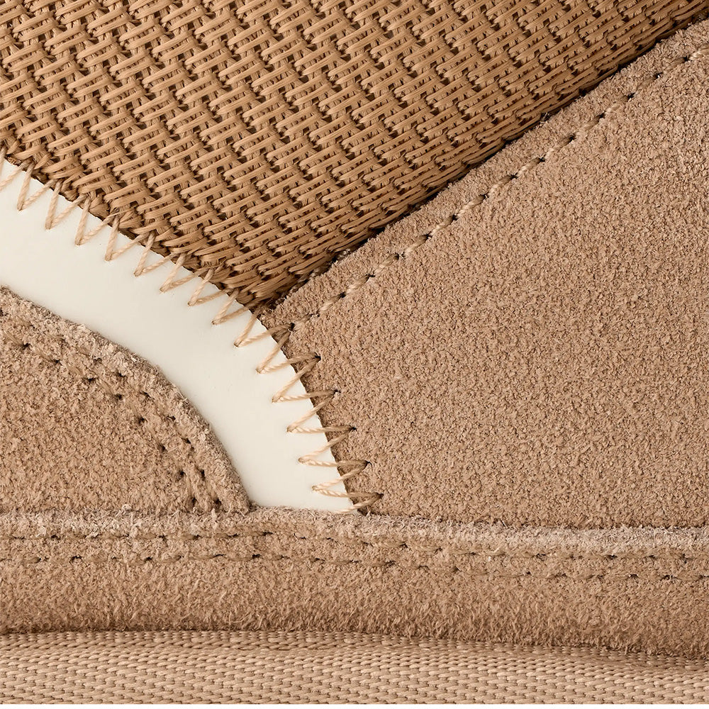 Sand UGG sneaker, close-up side view, suede, mesh, cream sole, detailed stitching.