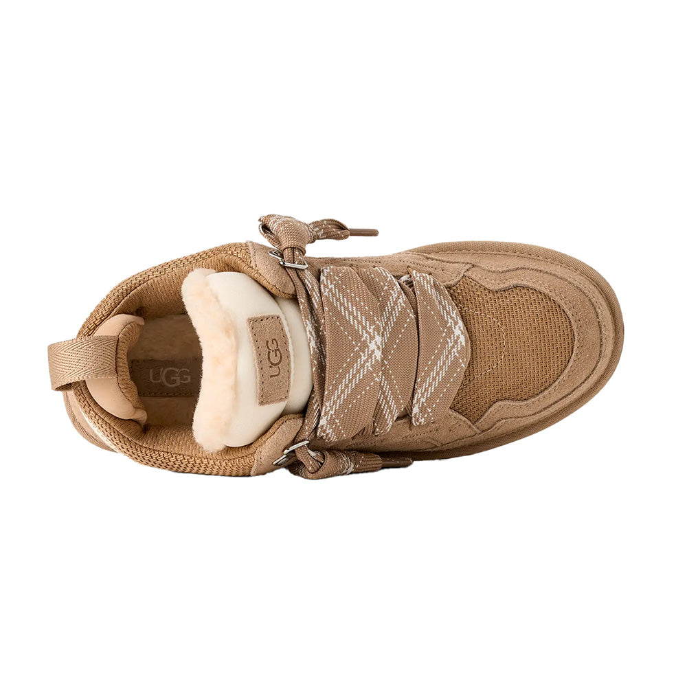 Sand UGG low-top sneaker, top-down view, suede, mesh, fuzzy lining, plaid laces, UGG logo.