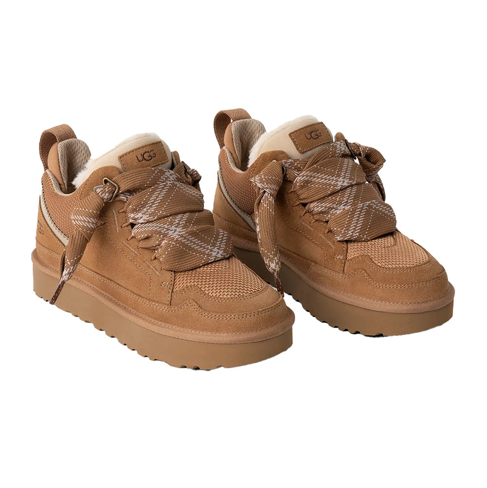 Chestnut UGG high-top sneakers with suede and mesh, plaid bow, cream sole, UGG logo, and pull tab.