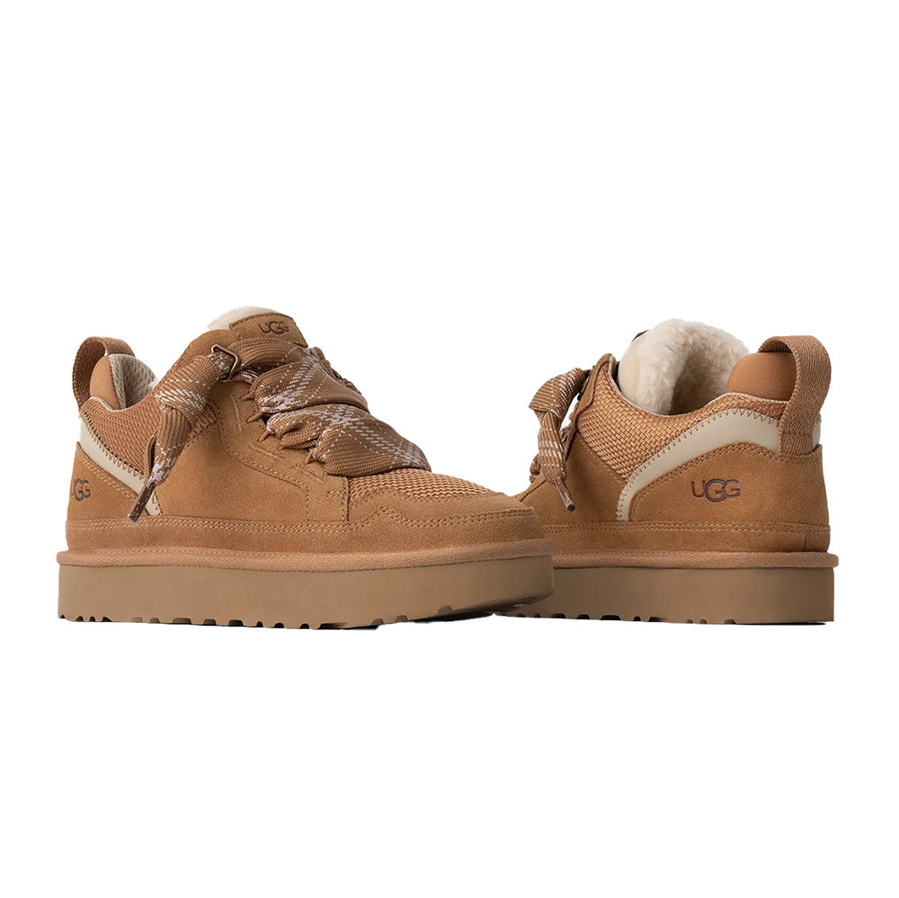 Chestnut UGG high-top sneakers with suede and mesh, plaid bow, cream sole, UGG logo, and pull tab.