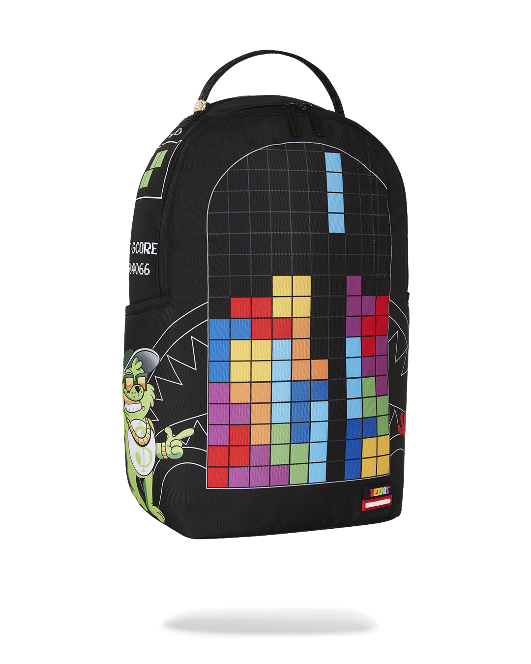 A black Sprayground backpack featuring a colorful Tetris game design on the front. On the left side of the Tetris grid is a grinning green monster with a gold chain and backwards baseball cap. A white graphic on the side of the bag reads "HIGH SCORE 14066." The bottom of the backpack has a small tag that says "TETRIS" and "SPRAYGROUND."
