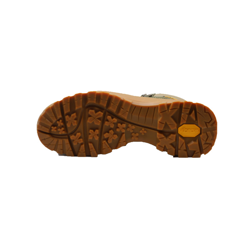 Sole of a green and sand Asolo hiking boot with a brown Vibram outsole featuring deep treads and a yellow 'Vibram' logo