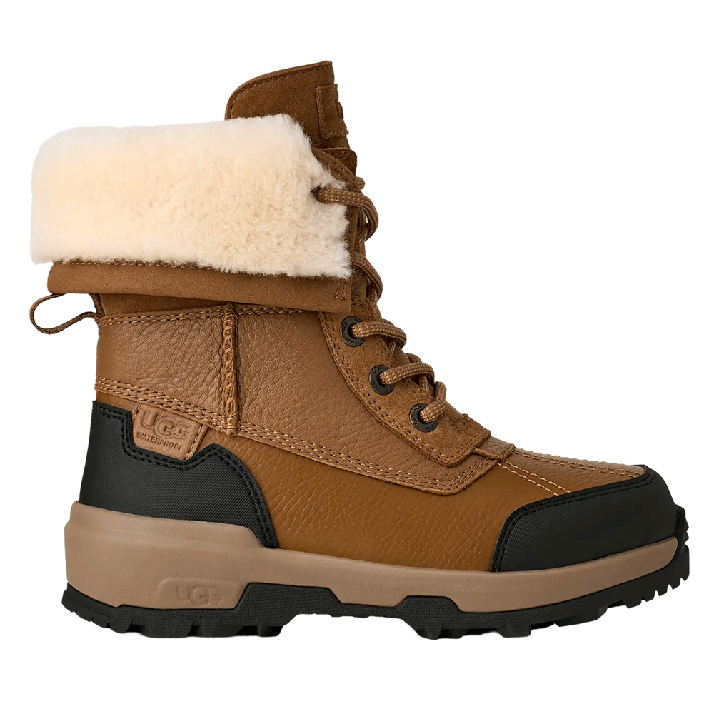 UGG Kid's waterproof brown leather winter boot with a lace-up front, tan shearling fold-over cuff, and rugged black and tan traction sole.