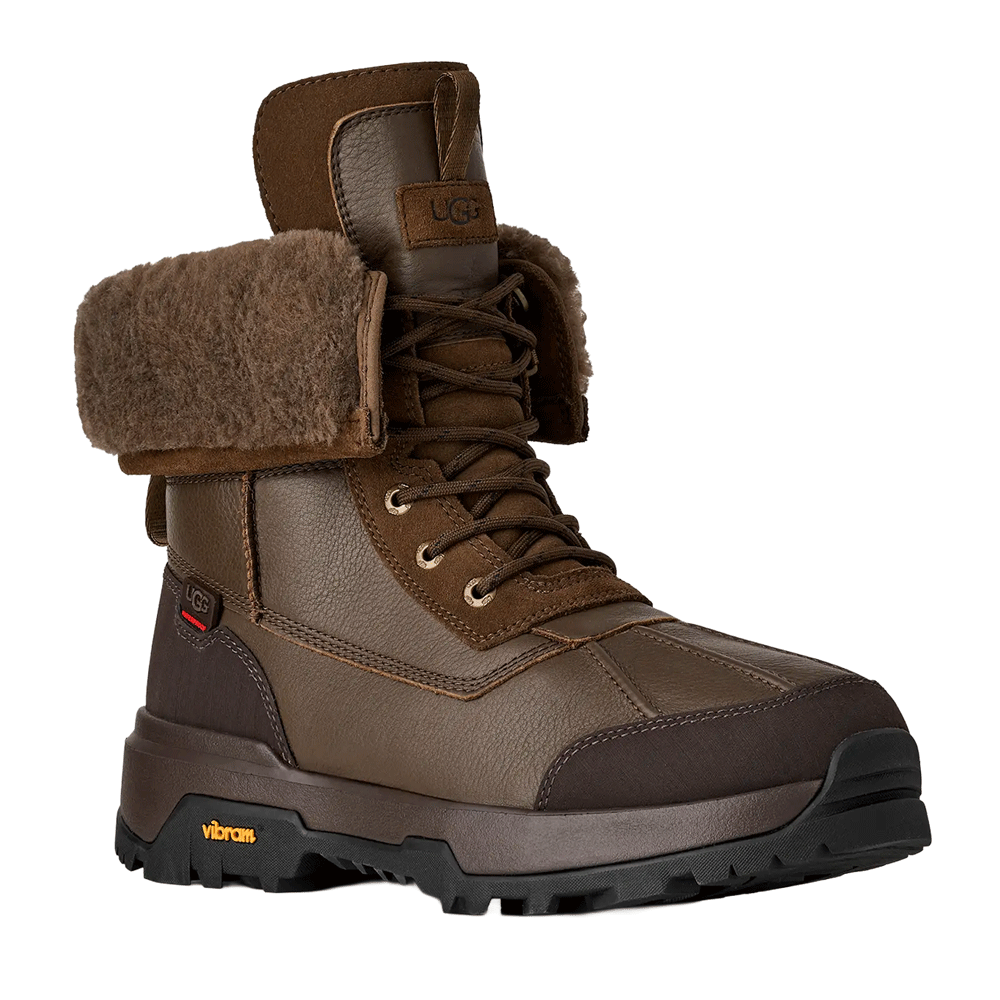 Front view of the Dark Toffee waterproof UGG leather boot with a fuzzy brown cuff, dark brown laces, and a rugged brown and black Vibram sole.