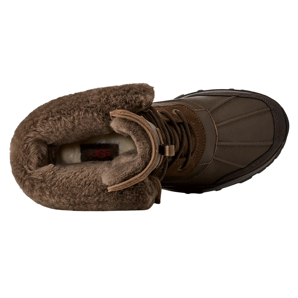 Top-down view of the Dark Toffee waterproof UGG boot, highlighting the fuzzy brown shearling interior lining and cuff, and the leather toe box stitching.