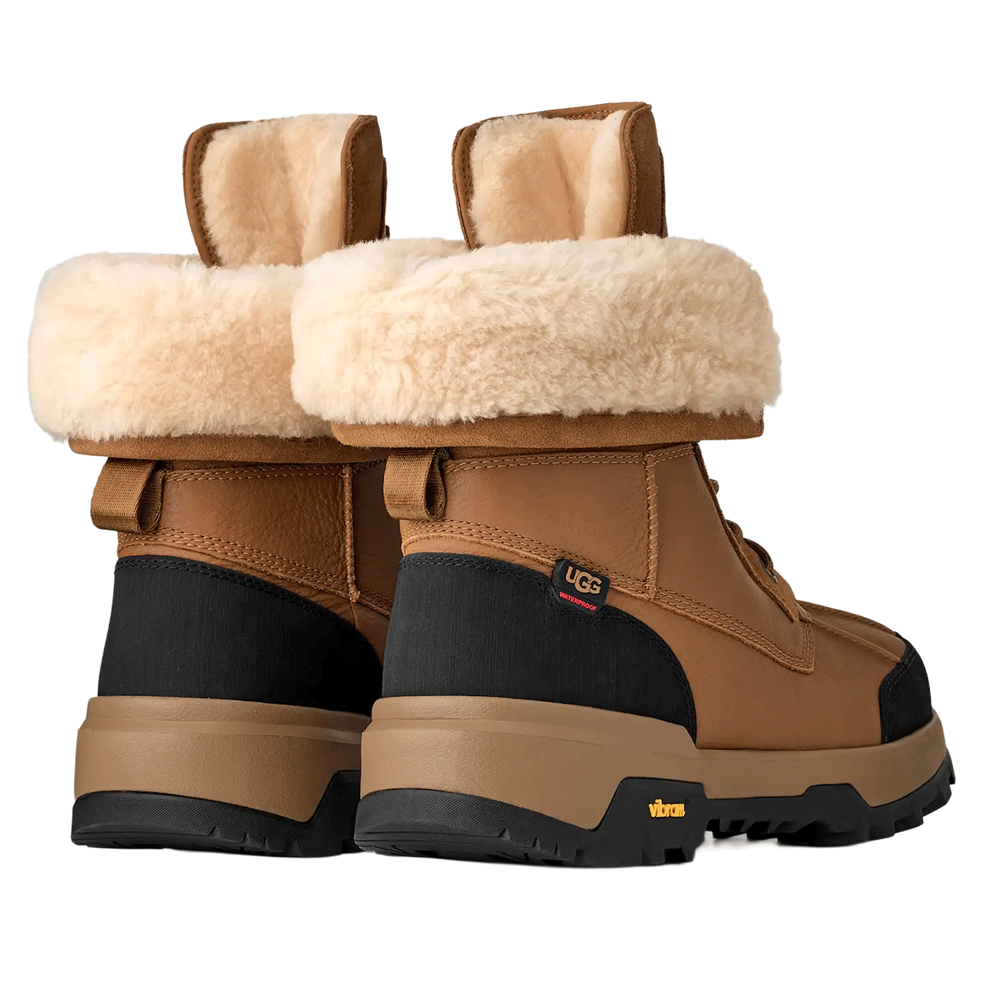Rear view of a pair of Chestnut waterproof UGG boots, showing the cream shearling cuffs, the black textile panels on the heel, and the thick brown and black Vibram soles.