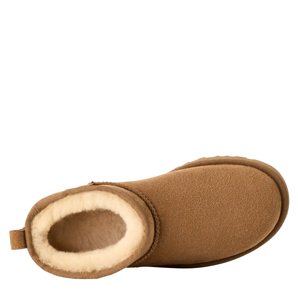 Top-down view of a single UGG Women's Classic Ultra Mini boot in chestnut. The view looks directly into the shaft opening, revealing the thick, white UGG plush wool lining and the rounded toe box shape.