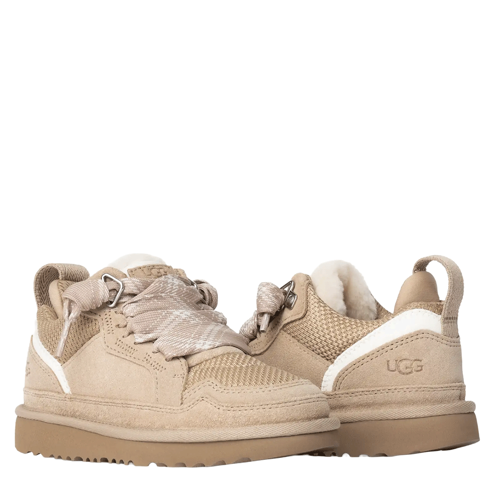 Rear view of a pair of Sand UGG Lowmel low-top sneakers, featuring a suede and textile mesh upper, a rear pull tab, and a white stripe accent on the heel above the textured Sugarcane EVA sole.