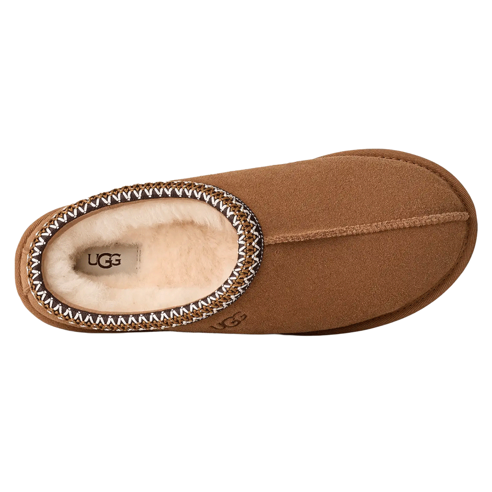 Overhead view of the chestnut UGG Tasman II slipper. The image shows the plush, cream-colored sheepskin lining and insole, the internal UGG logo tag, and the multi-colored UGGbraid trim around the collar. The suede upper has a central seam extending to the rounded toe.