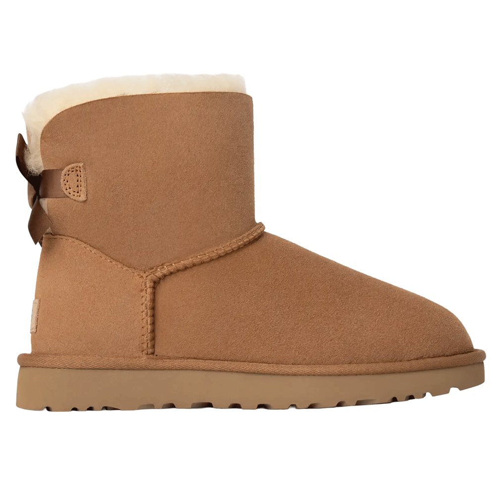 UGG Mini Bailey Bow II boot in chestnut suede/sheepskin, featuring a satin bow detail on the back shaft and visible shearling lining.