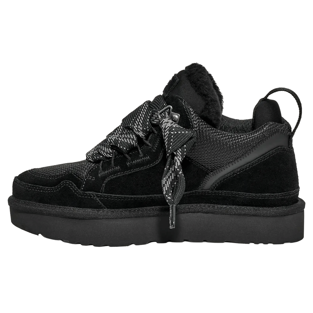 Side profile of the black UGG Lowmel sneaker with a suede and mesh upper. The shoe features a thick black sole, a plush UGGplush™ wool/lyocell lining visible at the collar, and wide, loose two-tone patterned laces.