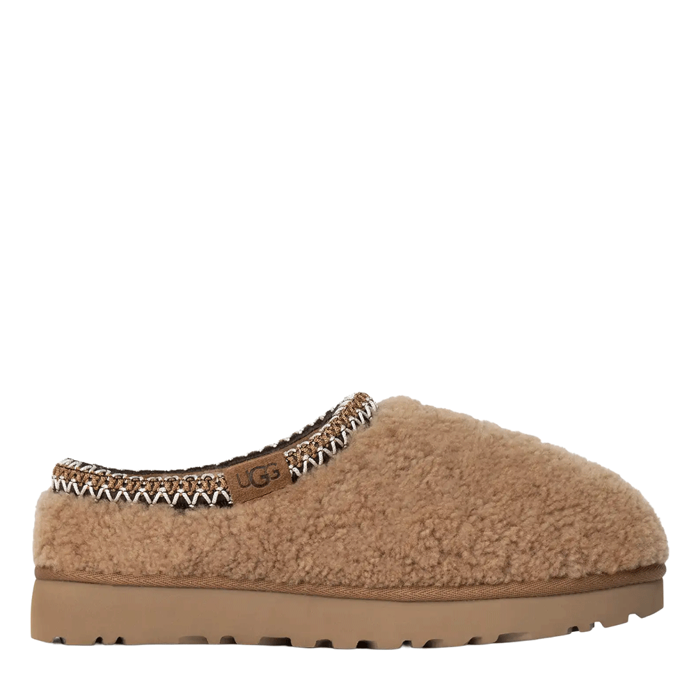 Side view of the Chestnut Tasman Maxi Curly UGG slipper, featuring a curly sheepskin upper, a decorative UGGbraid collar made with recycled fibers, and a chunky Sugarcane EVA platform outsole.
