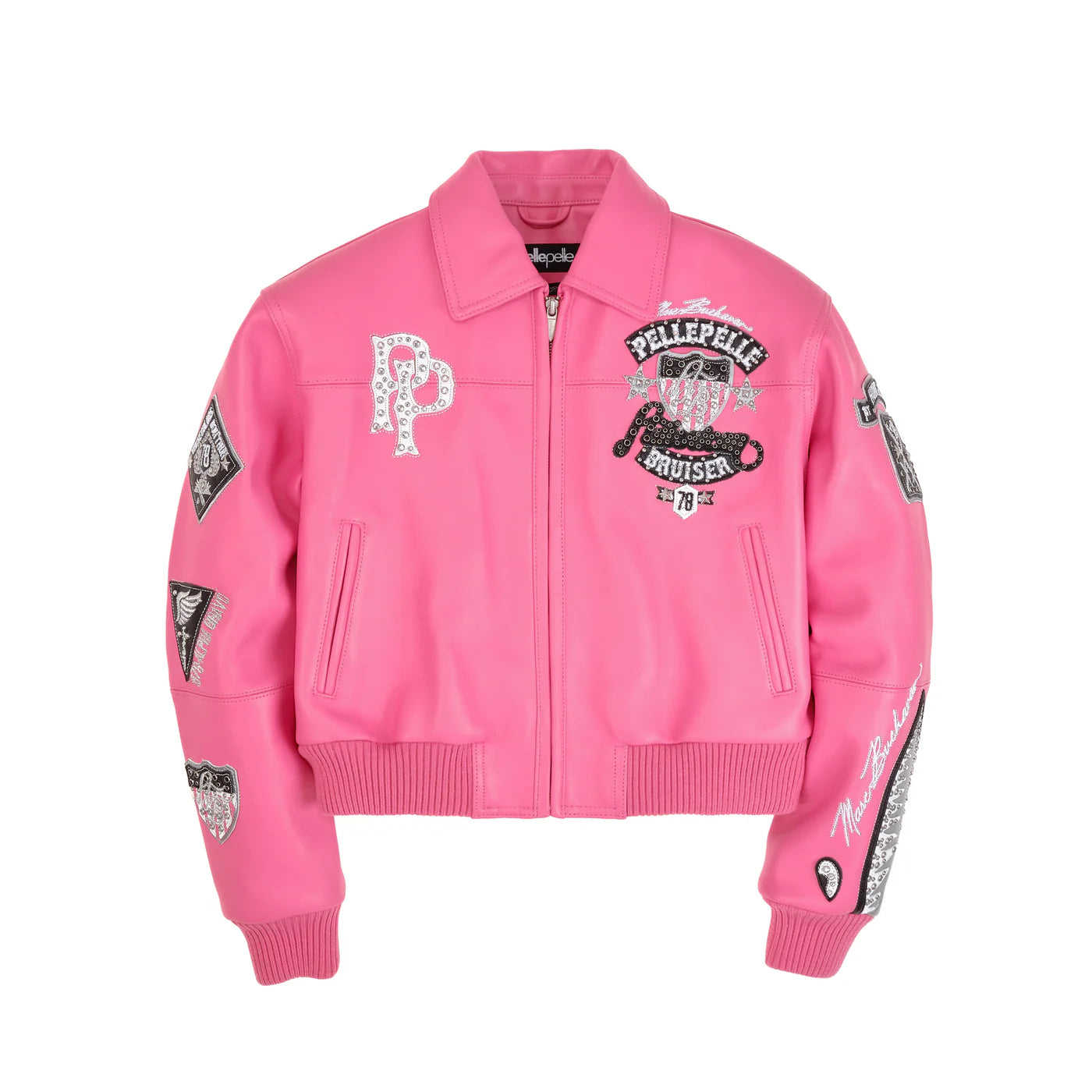 A vibrant, hot-pink leather jacket from Pelle Pelle with a cropped, bomber-style fit. The jacket features multiple embellished patches with a mix of sequins, studs, and embroidery. A large "PP" logo is on the left chest, and a larger patch on the right features a silhouette of a Panther. The sleeves are adorned with additional patches and a sequined graphic. The collar and cuffs are a matching pink, and the jacket has a zippered front and two front pockets.