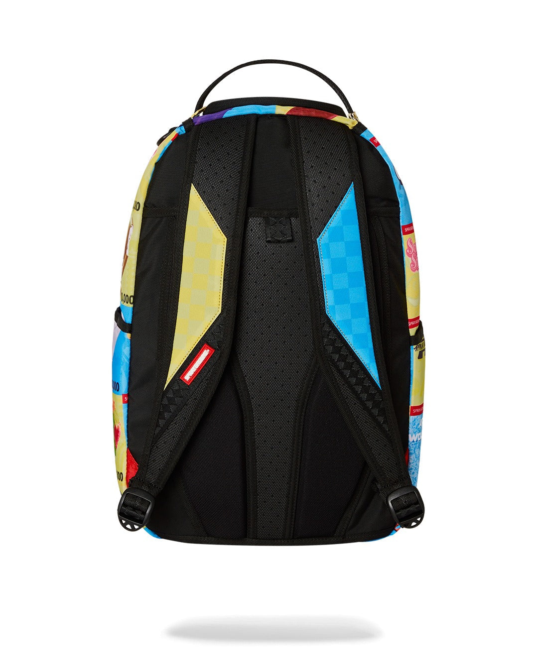 A back view of a vibrant Sprayground backpack. The main shoulder straps are black and padded. The top of the straps features a colorful checkered pattern—yellow on the left and blue on the right. The back panel is black with a textured, padded finish for comfort. A red tag with the Sprayground logo is visible on the bottom of the left strap.