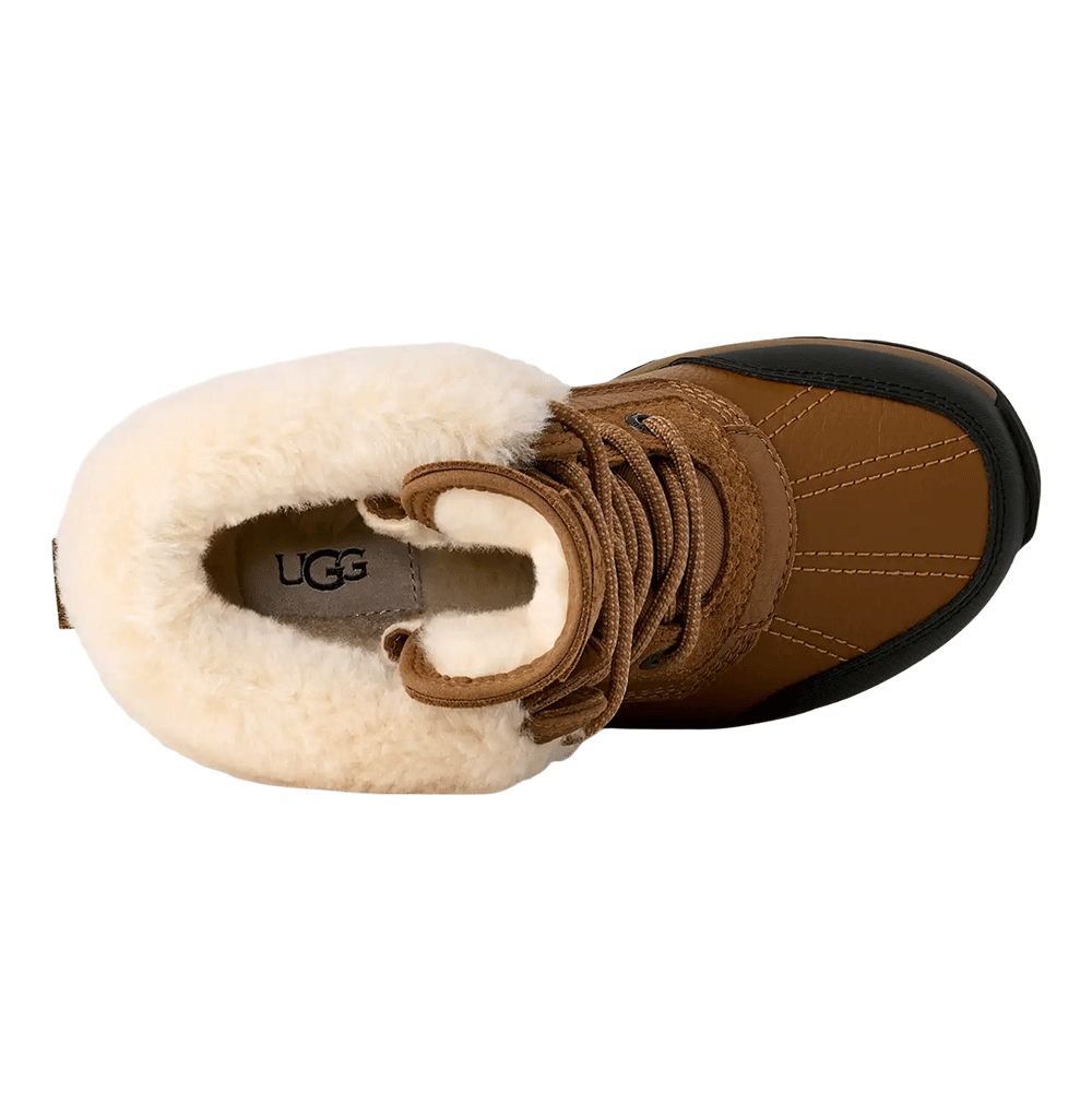 Top-down view of the UGG brown winter boot, highlighting the interior cream shearling lining, the UGG logo on the footbed, and the lace-up closure.