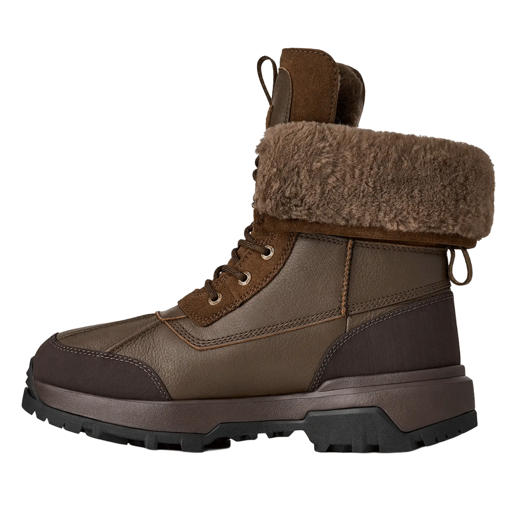 Side profile of the Dark Toffee waterproof UGG boot, featuring a rich brown leather upper, suede accents, a fuzzy brown cuff, and a substantial dark brown sole.