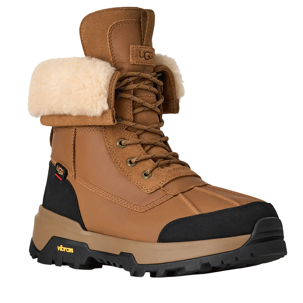 Front view of the Chestnut waterproof UGG leather boot with a cuffable cream shearling collar, brown laces, and a rugged black and brown Vibram sole.