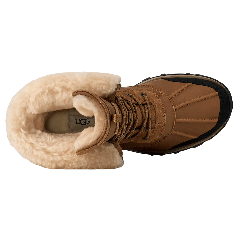 Top-down view of the Chestnut waterproof UGG boot, highlighting the plush cream shearling interior lining and cuff, and the stitched leather toe box.