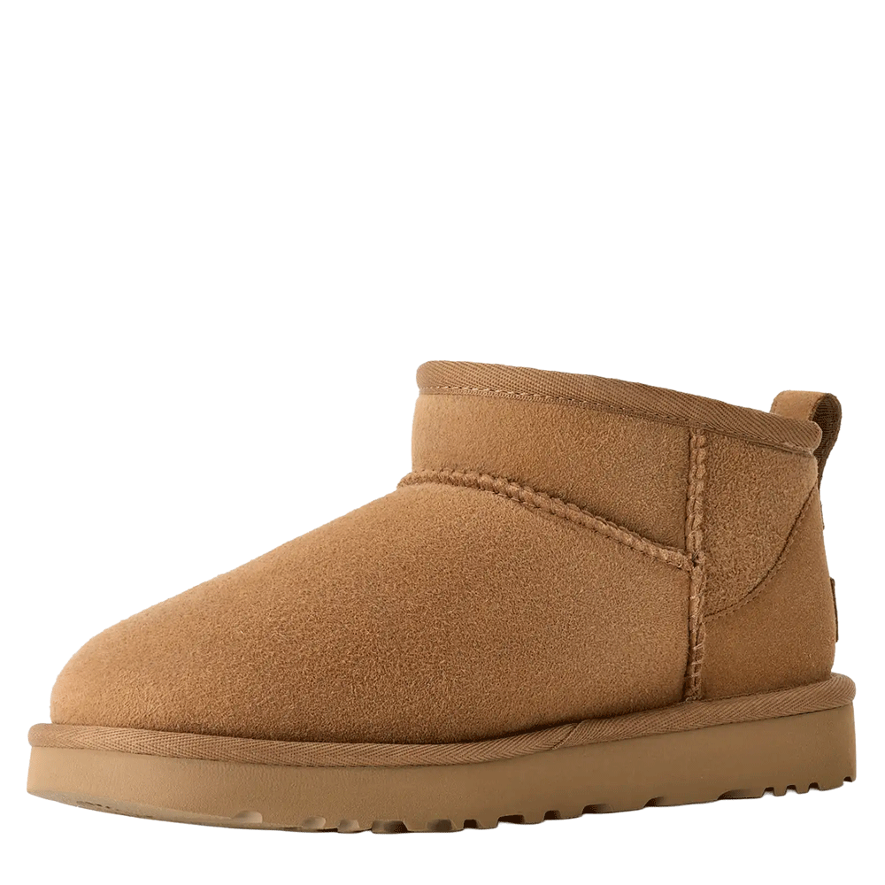 Front View of a single UGG Women's Classic Ultra Mini boot in chestnut. The image prominently displays the rounded toe box, the low-cut shaft, and the thick, flat brown sole.