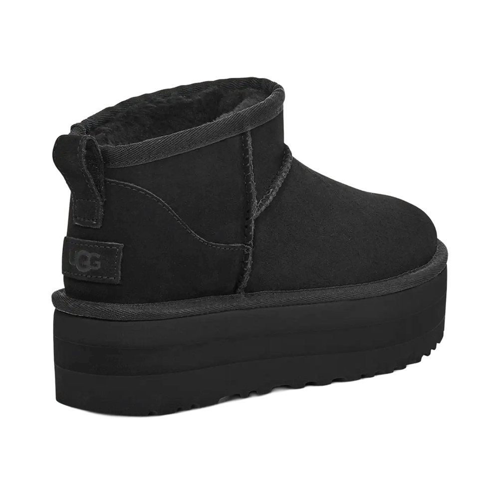 Back View Of Black suede UGG Classic Boot Ultra Mini Platform with thick elevated sole, rear pull tab, and visible UGGplush lining inside.