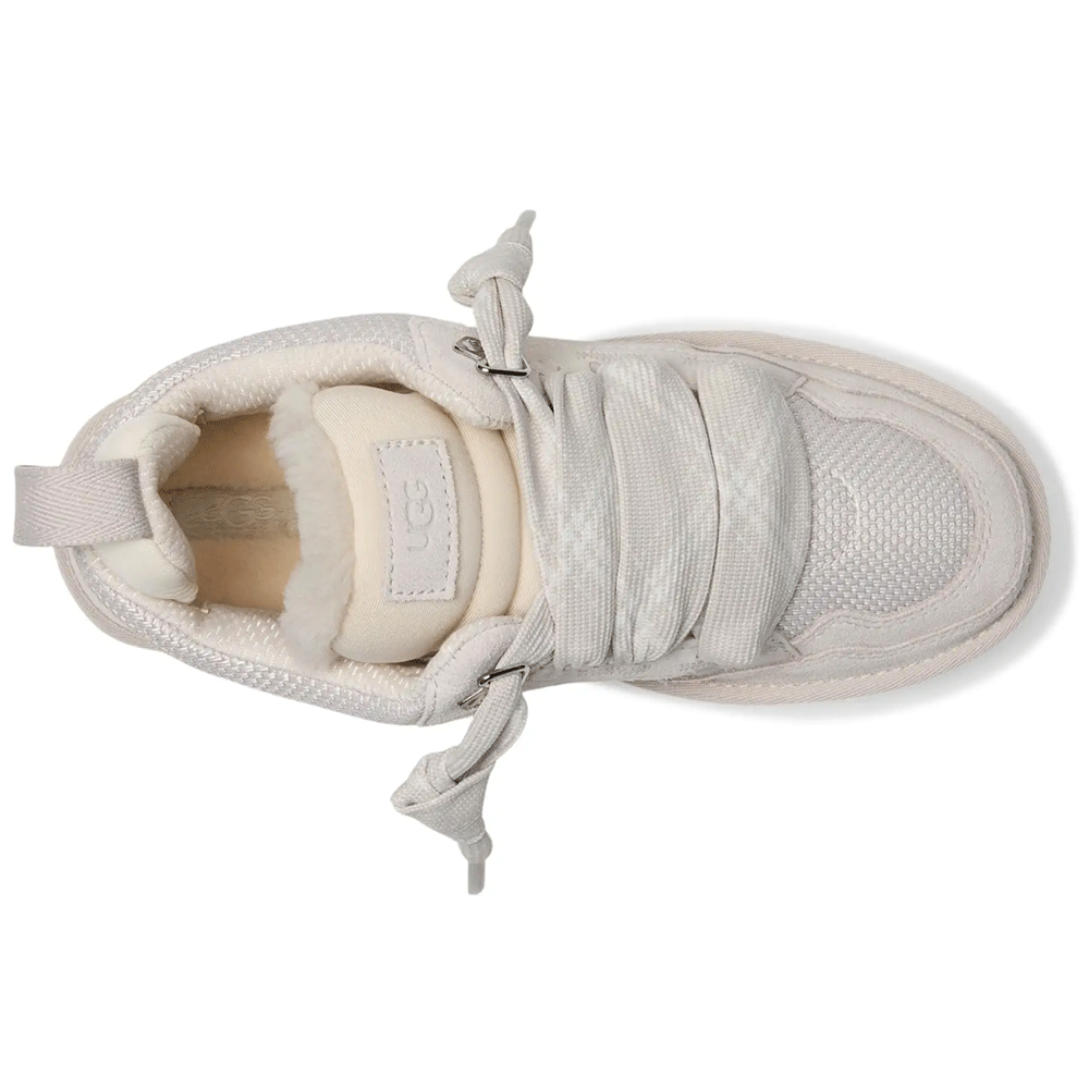 Top-down view of the UGG Lowmel sneaker in a light color, clearly showing the UGG logo patch on the oversized padded tongue, the plush UGGplush lining, and the thick, loosely tied laces.