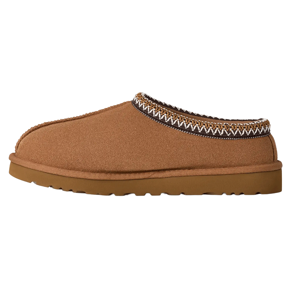 Side profile of a chestnut UGG Tasman II slipper with a suede upper and a Sugarcane EVA outsole. The collar is trimmed with the signature UGGbraid in white and brown zig-zag pattern.