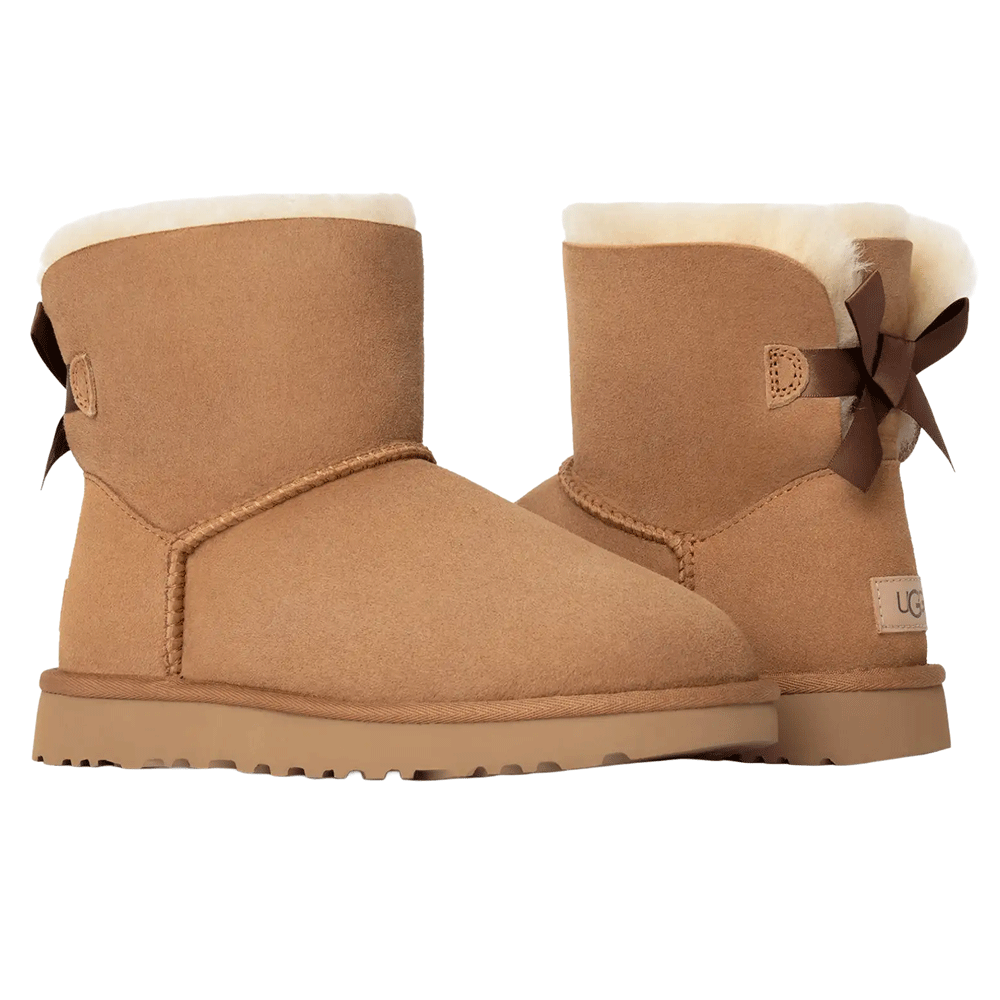 A front-facing pair of UGG Mini Bailey Bow II boots in chestnut, showing the satin bows on the back of both heels and the shearling cuff lining.