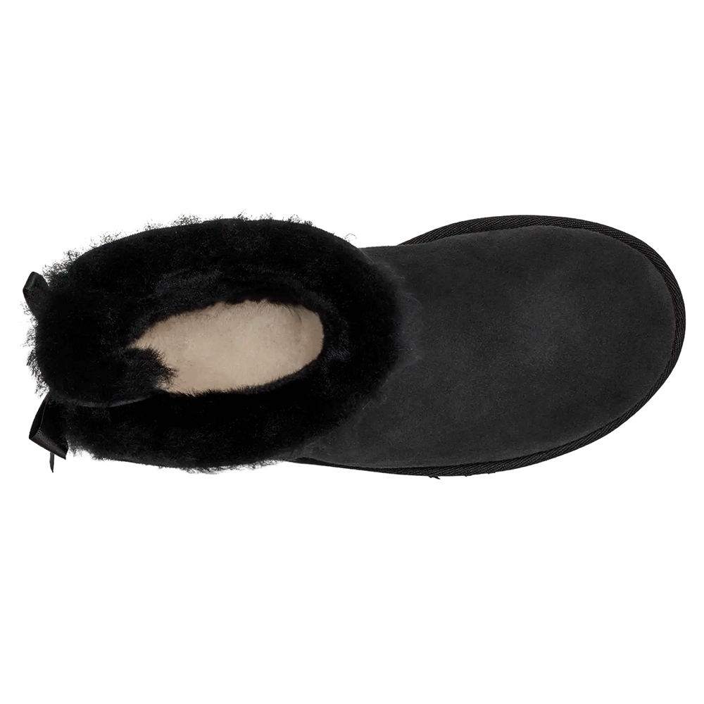 Top-down view of the Black UGG Mini Bailey Bow II boot, showcasing the short shaft, the plush black fur lining, the off-white UGGplush footbed, and the fixed black satin bow at the heel.