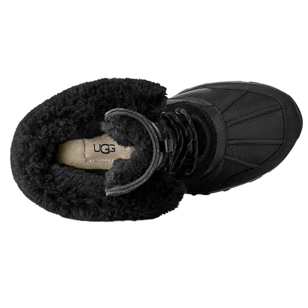 Top-down view of the Black UGG Adirondack Boot XXV, showcasing the plush black fur lining, the tongue, and the UGG logo on the footbed.