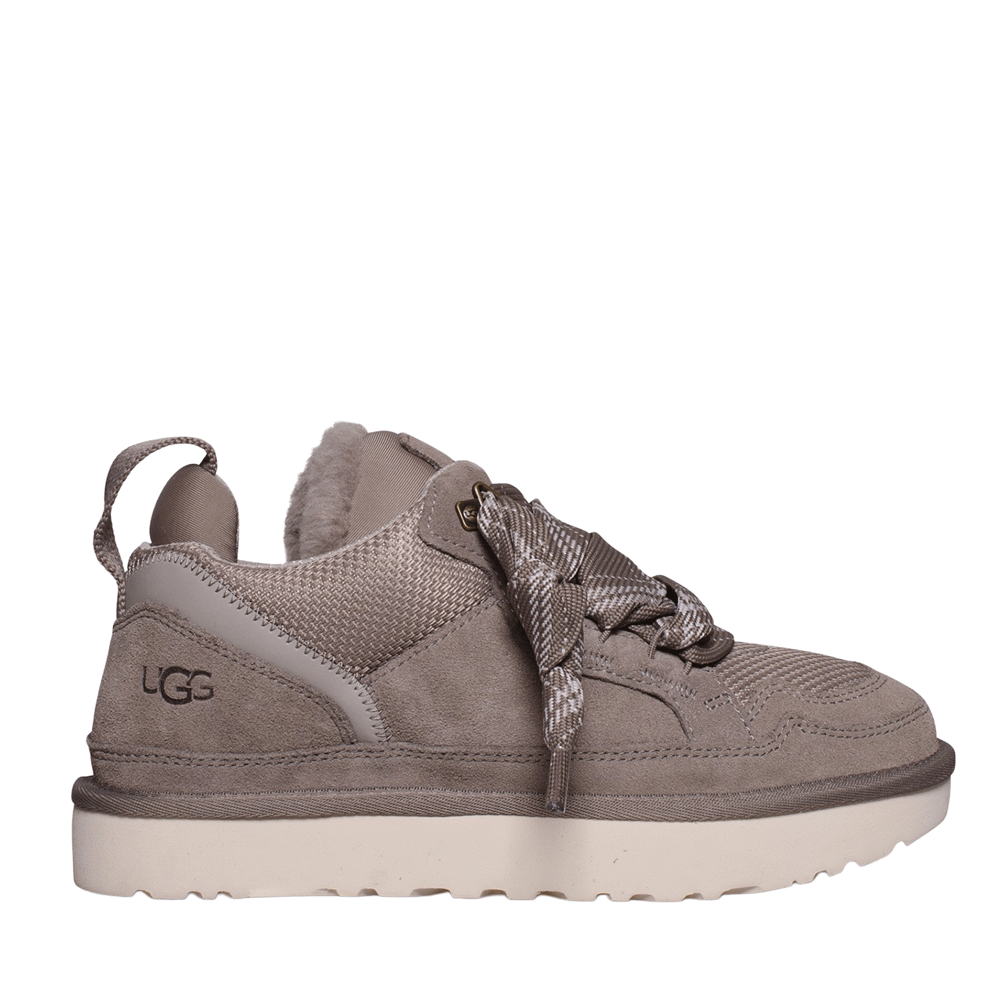 Side profile of a UGG Lowmel sneaker in Smoke Plume (light gray/taupe), featuring a suede and mesh upper, loose two-tone laces, and a thick white sole.